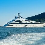 Huge luxury yacht cruising offshore Huge luxury yacht cruising offshore